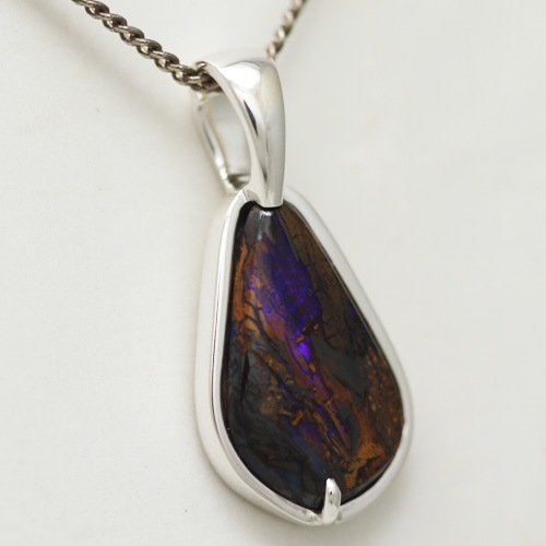 Stirling silver Pendant with SOLID BOULDER OPAL Purple fire amonst the mother stone